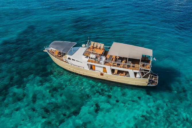 Blue Lagoon and 3 Island Boat Tour with Food and Drinks Included - A 9-hour boat day that mixes wreck views, clear water, and real beach time