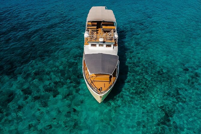 Blue Lagoon and 3 Island Boat Tour with Food and Drinks Included - Stop 1 on Šolta (Nečujam): wreck views and the swim option