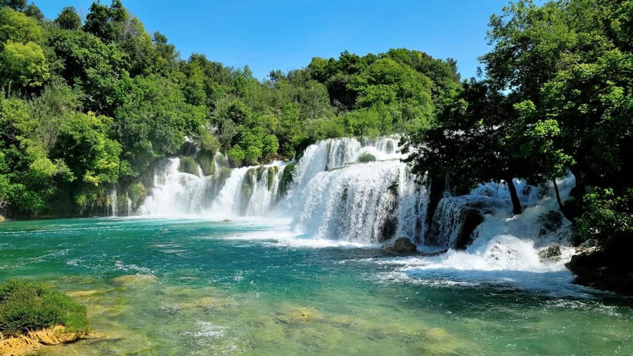 From Split: Krka Waterfalls Tour with Boat Ride & Swimming - River Boat to Skradin: The 30-Minute Switch in Pace