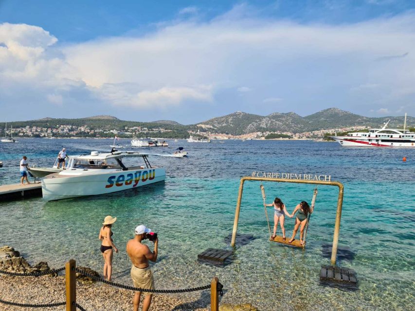 From Split: Luxury Cabin Boat Tour to The Blue Cave and Hvar - Stiniva cove: rocky cliffs and dolphin chances