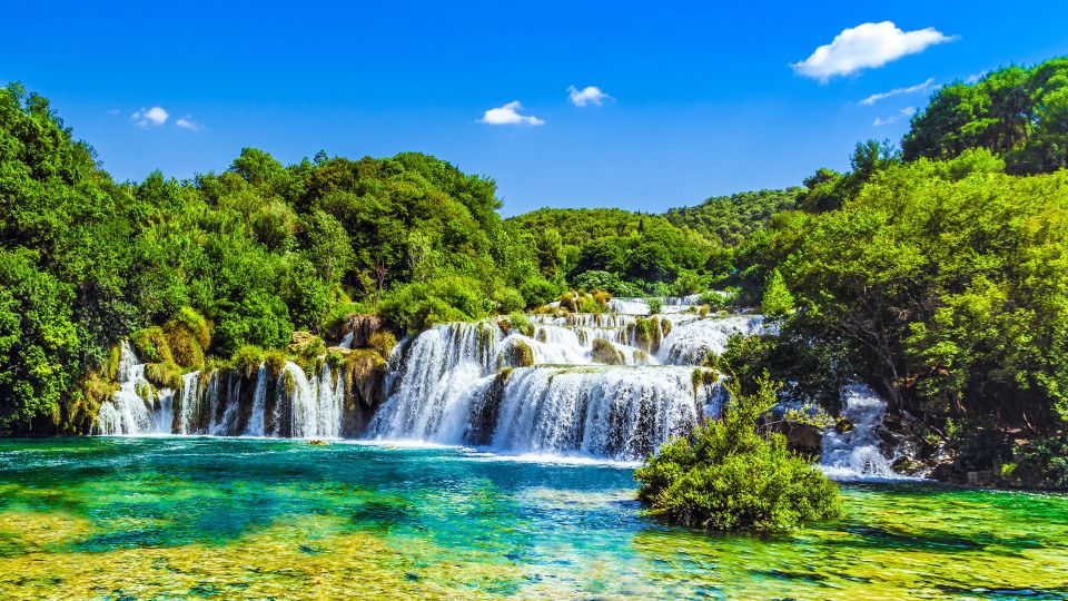 From Split & Trogir: Krka Waterfalls Day Tour with Boat Ride - Skradin time: swimming, snacks, and a calmer pace by the water