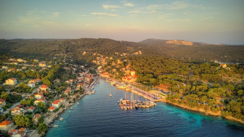 From Trogir: Sunset Private Tour - Maslinica at sea level: red roofs, fishermen, and a 1708 castle