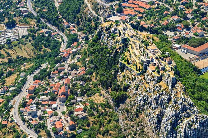 Sinj: Panoramic Flight over Peruca Lake and Dinara mountain - Sinj from Above: Alka Cannon Hill and Town Views