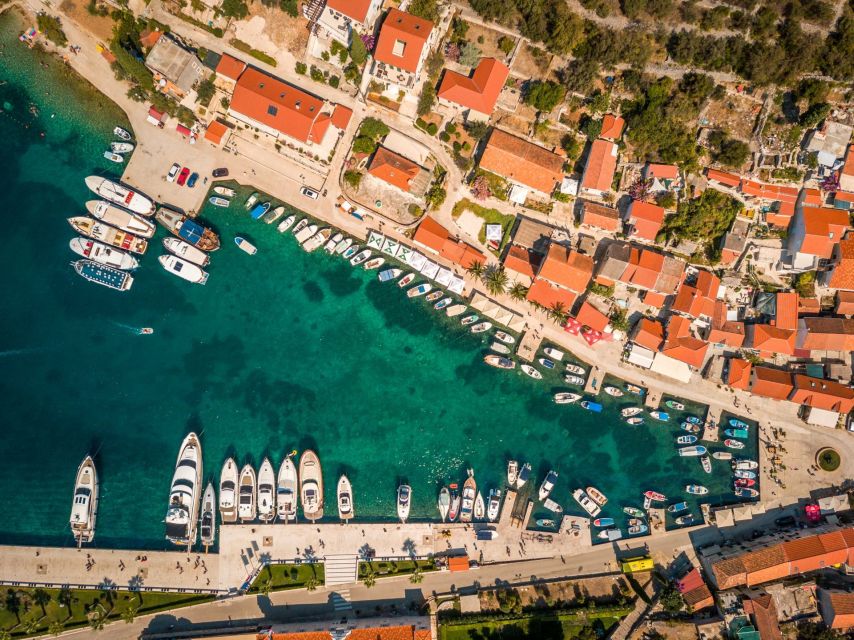 Split: Private Full Day Boat Trip to Blue Lagoon and Trogir - Maslinica fishing village walk: white stone streets and local life